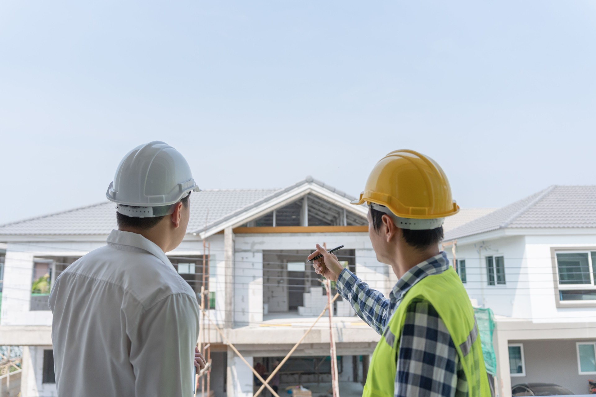 inspector engineer and owner project is inspecting construction and quality assurance new house. Engineers or architects or contactor work to build the house before handing it over to the homeowner